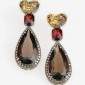 1. Earpieces, 18kt gold, citrines, garnets, smoked quartz, cognac diamonds 