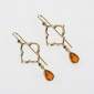 16. Earpieces, 18kt gold, black diamonds, fire opal 