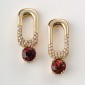 1. Earpieces, 18kt gold, diamonds, hessonites